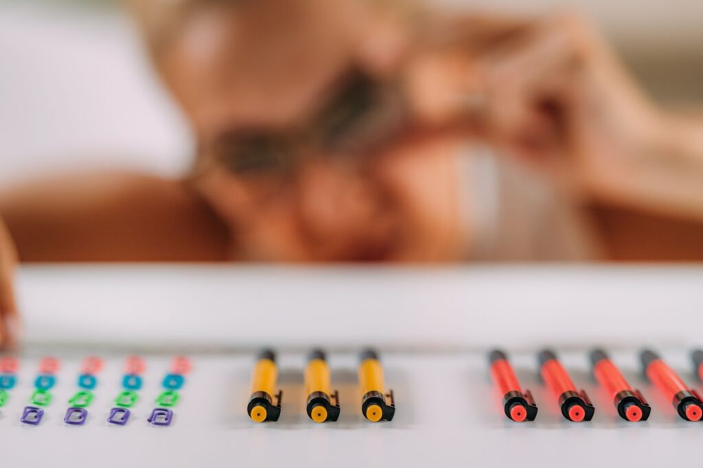 Person with OCD organizing pens and clips.